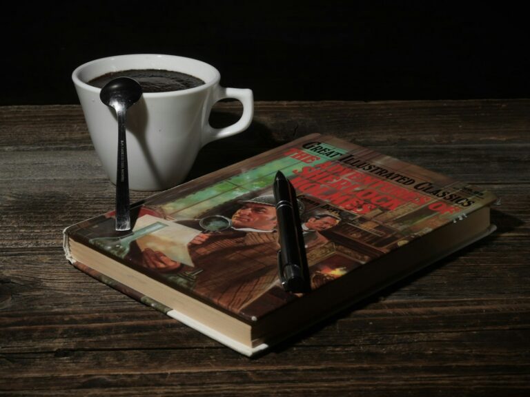 Stack mystery novels tea cup eyeglasses