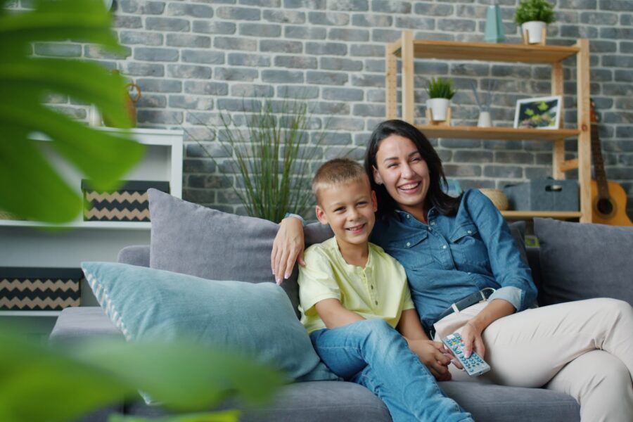 Family watching couch living room