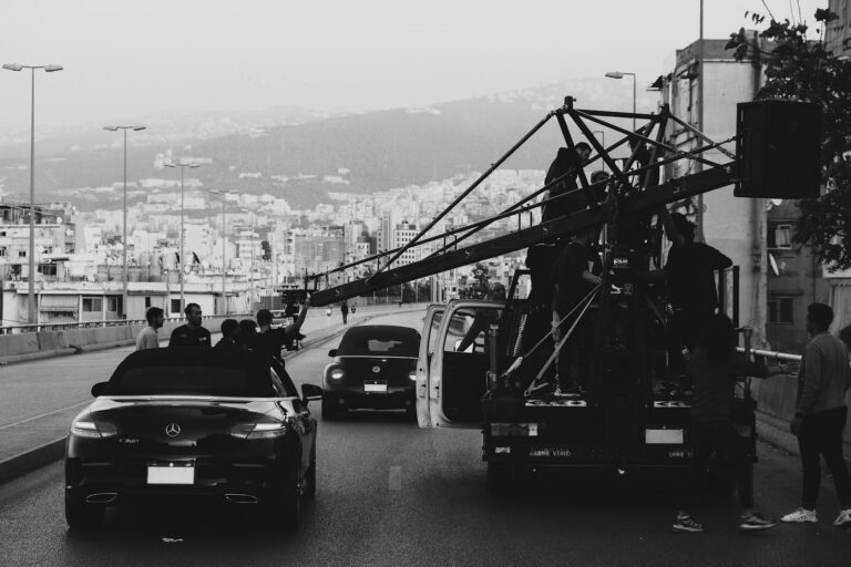 Film crew shooting city street iceland black sand