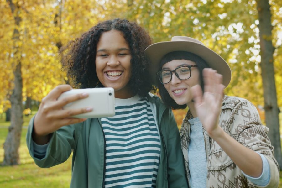 Friends using augmented reality app outdoors