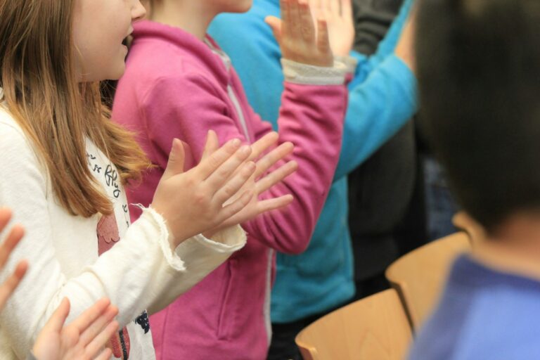 Child stage theatre spotlight family audience clapping theatre