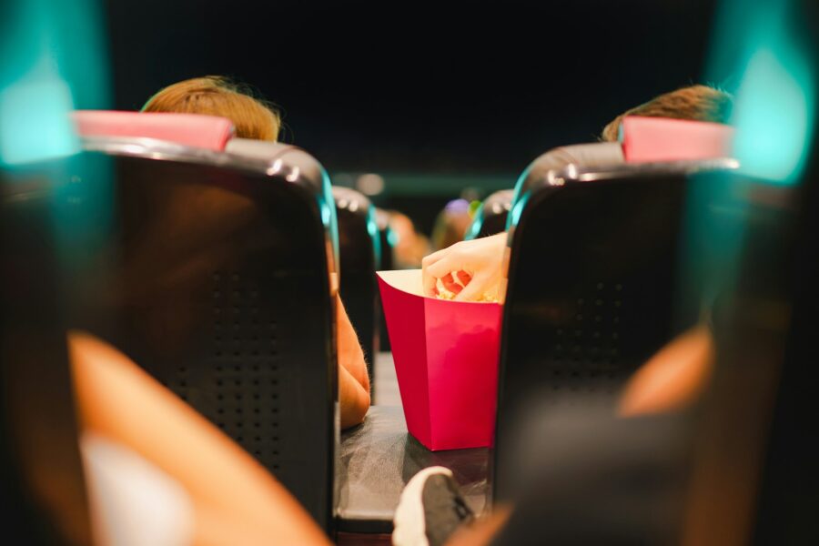 Crowded cinema audience night screen