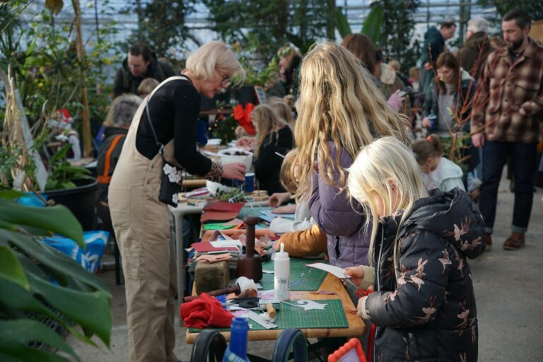 Artist market table handmade prints workshop table people
