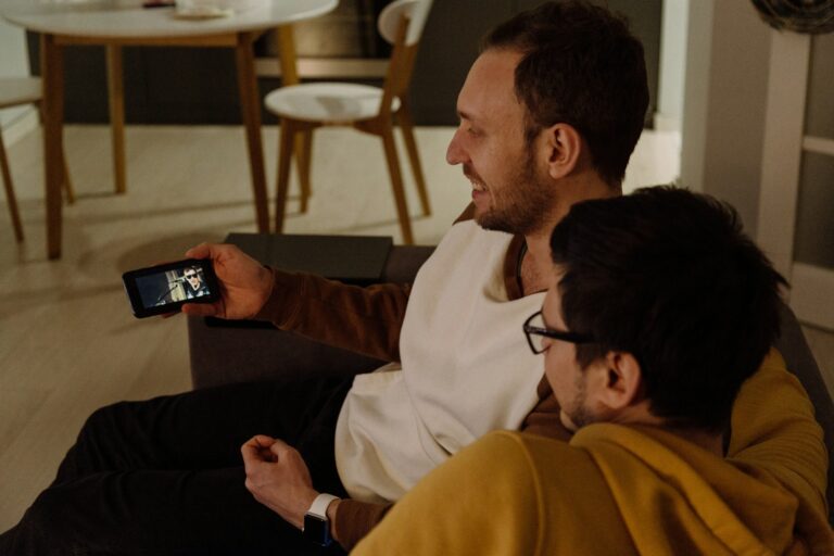Smartphone screen streaming clip subtitles group friends watching