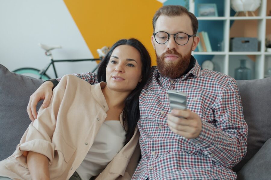 Couple watching couch living room