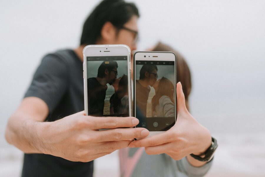 Celebrity couple holding hands smartphone screen