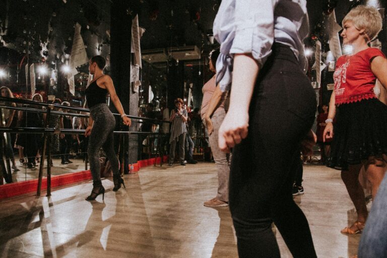 Choreographer teaching group dance mirrors