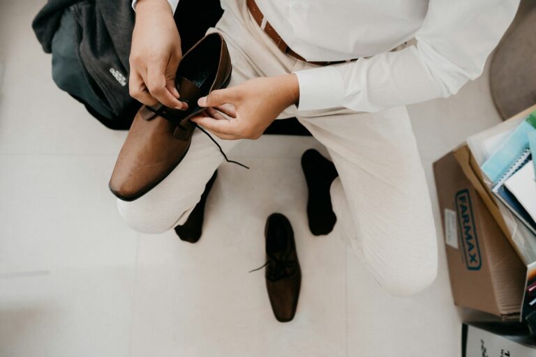 Flat lay neutral outfits shoes accessories person choosing
