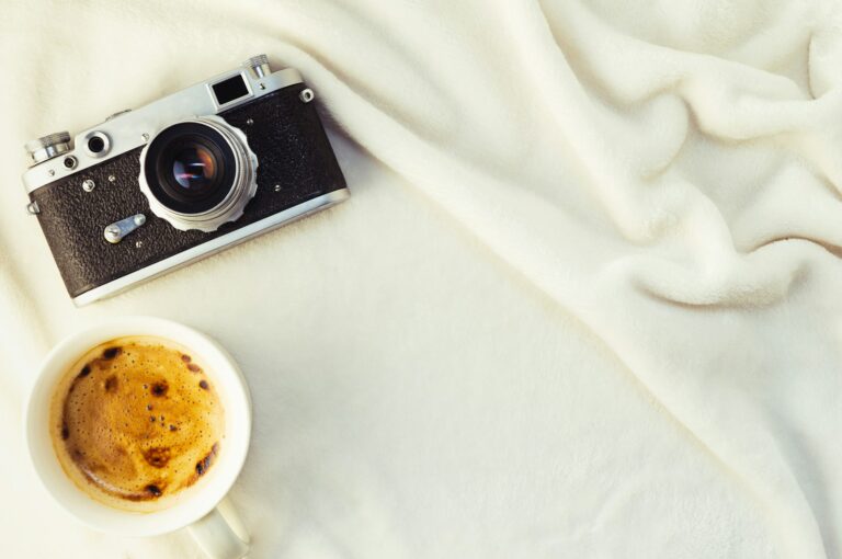 Flatlay knit sweater sneakers coffee cup