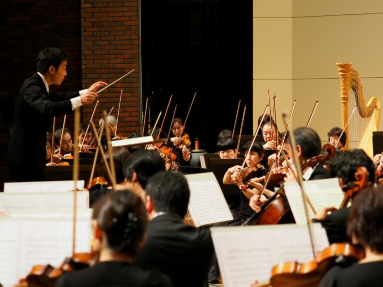 Orchestra musicians conductor close