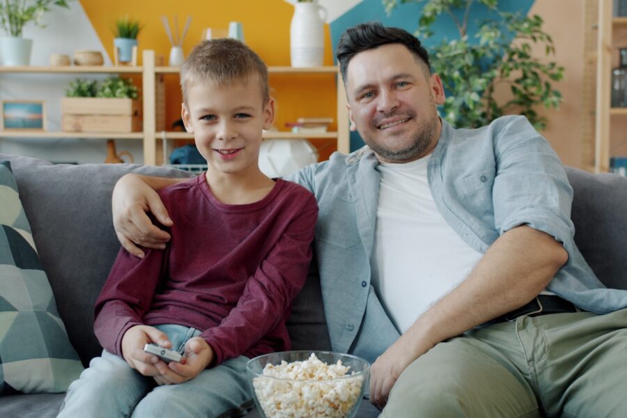 Family watching sofa popcorn blankets