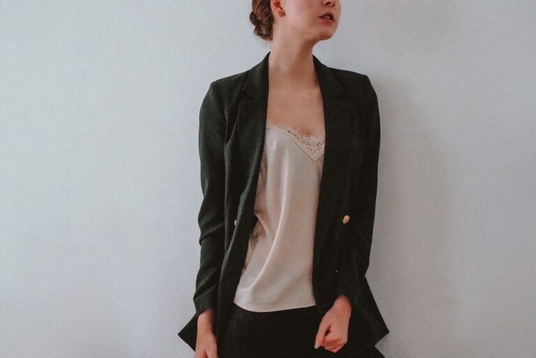 Woman layered outfit blazer slip dress ankle boots