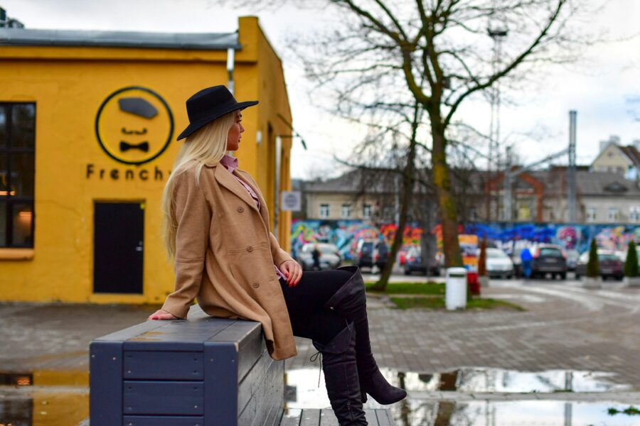 Woman beige trench coat city street