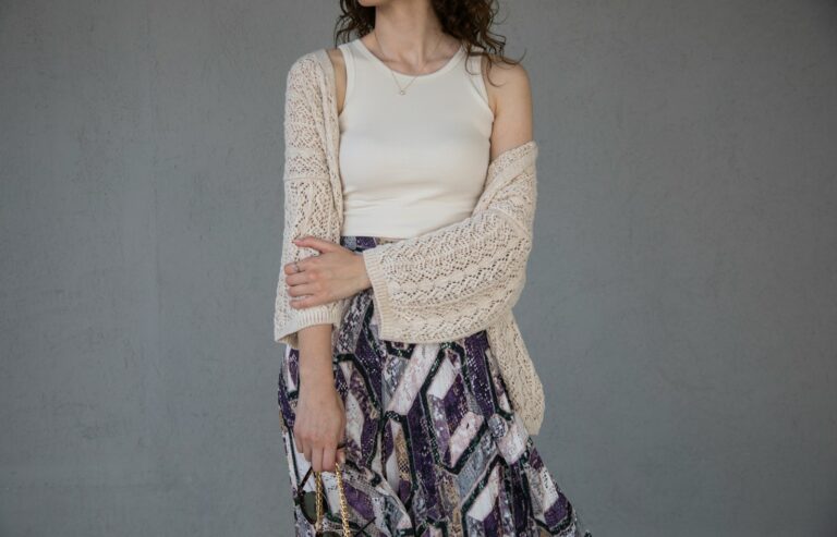 Flatlay knit sweater slip skirt jewelry