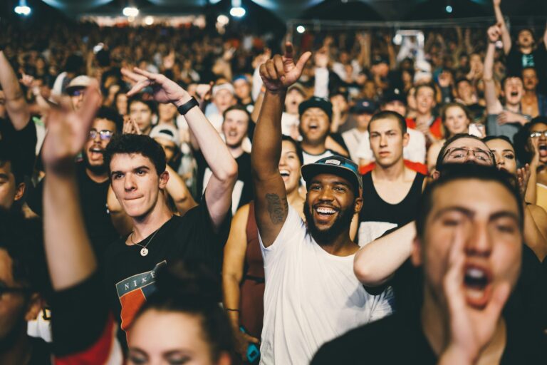 Fans singing along retro pop concert