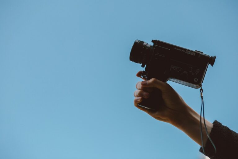 Person holding vintage camcorder grainy retro screen static