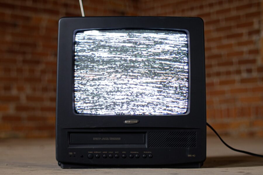 Retro vhs tape stack old television screen