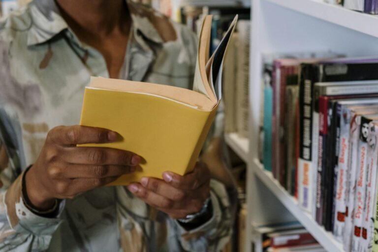 Person reading paperback