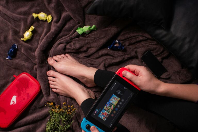 Cozy gaming setup warm lighting handheld game