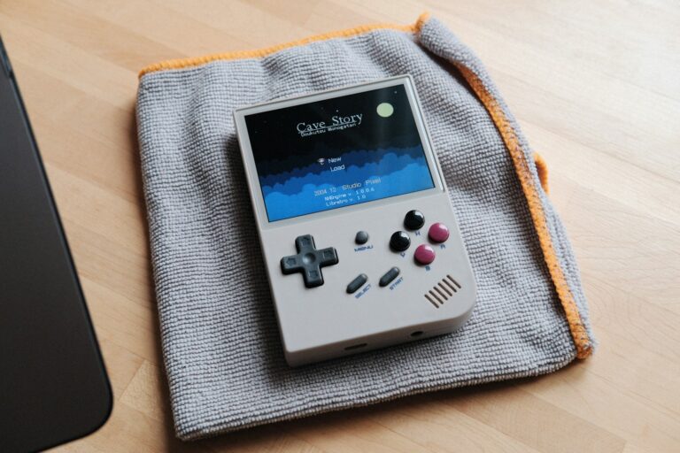 Cozy gamer playing handheld console blanket tea