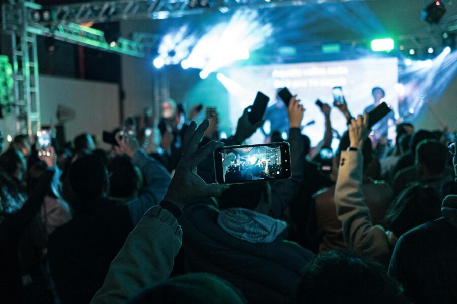 Concert crowd smartphones glow light sticks
