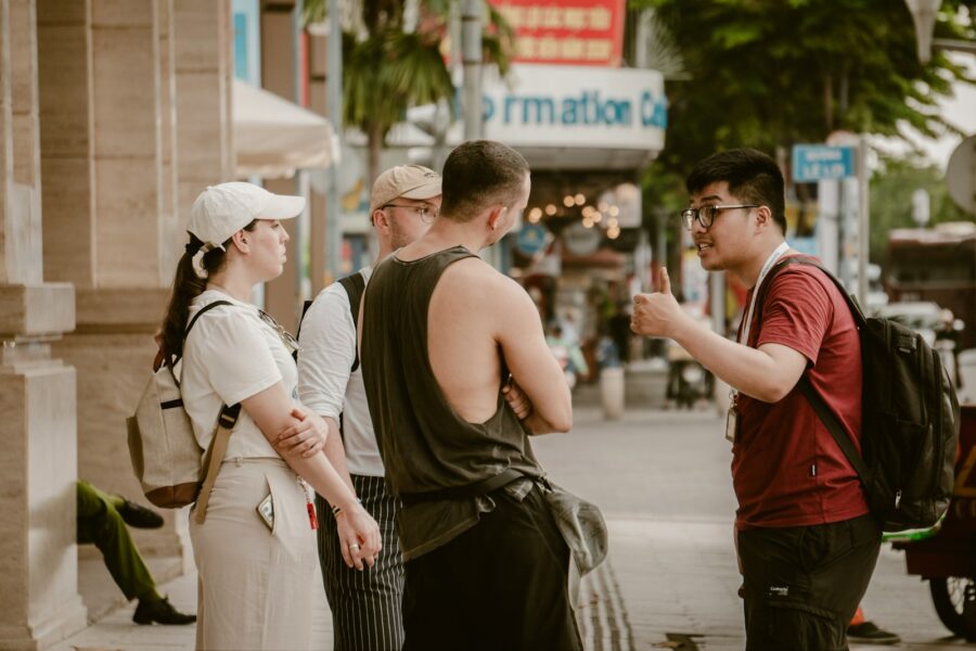 Contestants backpacks running foreign city street