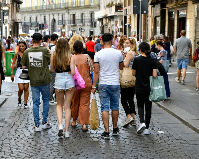 Contestants backpacks running foreign city street