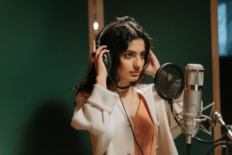 Singer recording vocals home studio microphone headphones