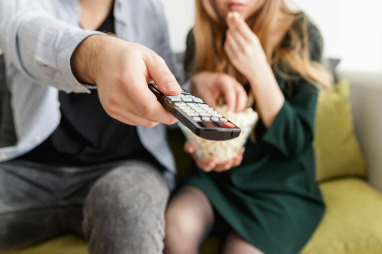 Living room sofa television remote snacks evening