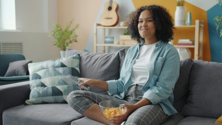 Living room sofa television remote snacks evening detail