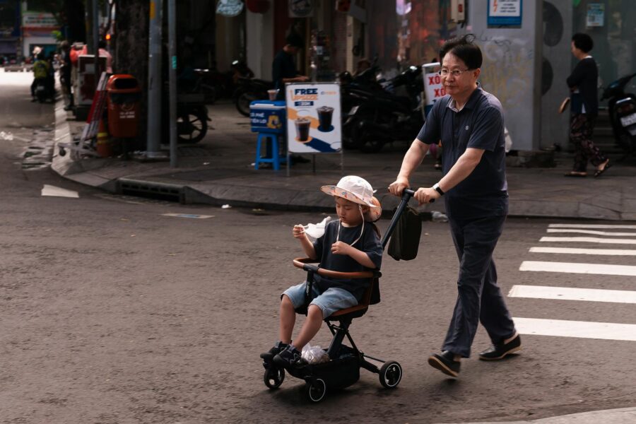 Father street style stroller sneakers city sidewalk