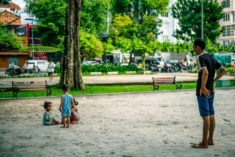 Father playing child park casual outfit