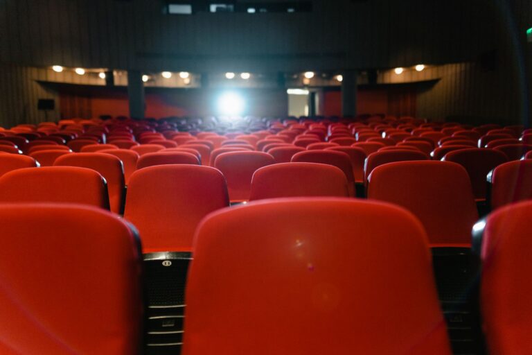 Concert film audience cinema screen stage lights detail
